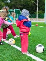 toddler playing soccer