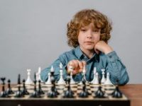 a smart boy playing chess