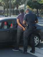 a police arresting a man