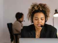 woman in black blazer sitting on chair