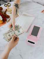 handing of dollar bills