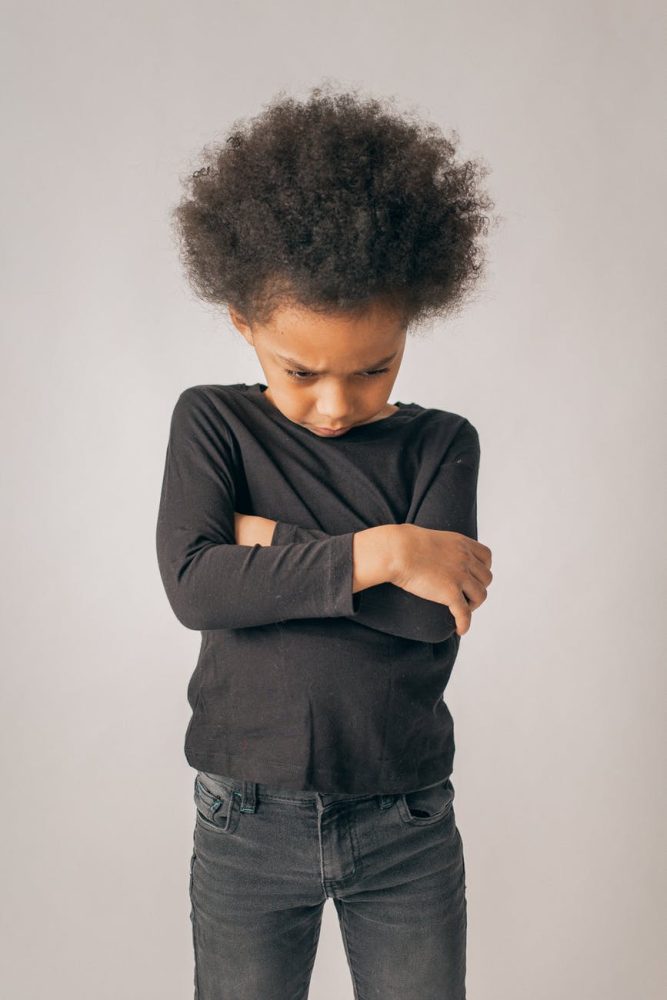 unhappy black girl in studio